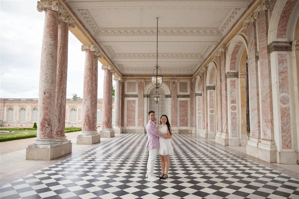 Alex and Yashi together in a marble colonnade